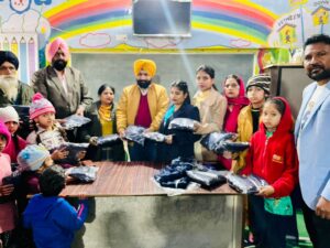Jasbir Singh, Gurjant Singh distributed track suits to students of Govt School Akaut