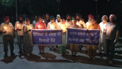 Akali Dal holds candle march over decision to auction building of power colony school