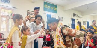 Gems Public School girls tie Rakhi on the wrists of ITBP officials