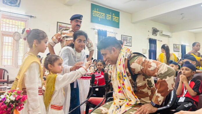 Gems Public School girls tie Rakhi on the wrists of ITBP officials